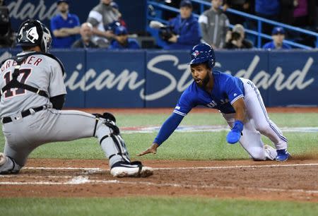 Mar 31, 2019; Toronto, Ontario, CAN; Toronto Blue Jays shortstop Richard Urena (7) is tagged out at the plate by Detroit Tigers catcher Grayson Greiner (17) in the tenth inning at Rogers Centre. Mandatory Credit: Dan Hamilton-USA TODAY Sports