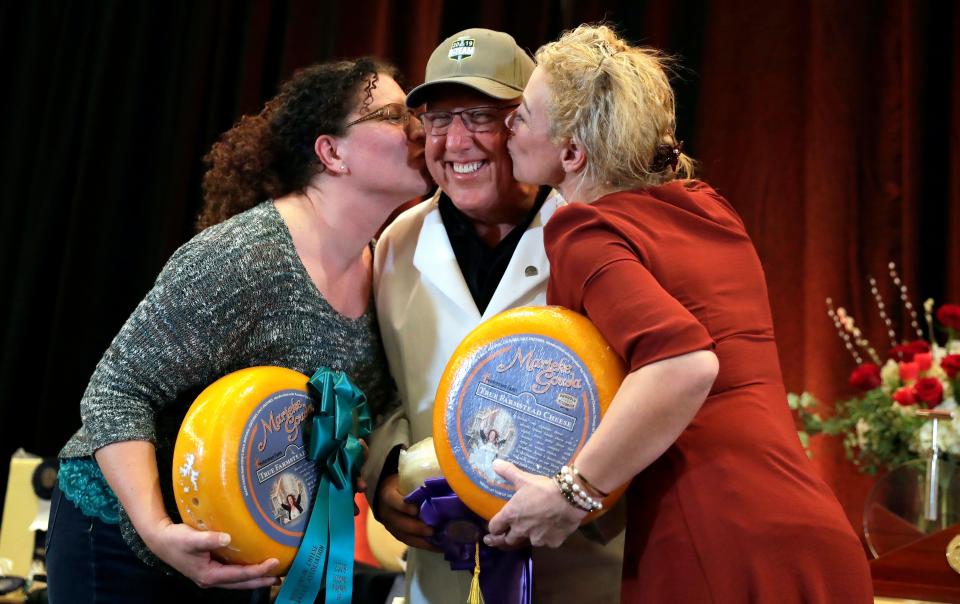 Richard Guggisberg, center, of Guggisberg Cheese in Ohio celebrates a first-place victory at the U.S. Championship Cheese Contest with Kim Rabuck and Marieke Penterman of Marieke Gouda, which took second and third places, on March 7, 2019 in Green Bay, Wis. Sarah Kloepping/USA TODAY NETWORK-Wisconsin