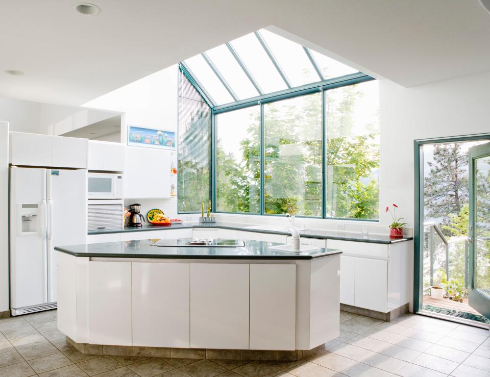 A modern kitchen featuring skylight windows