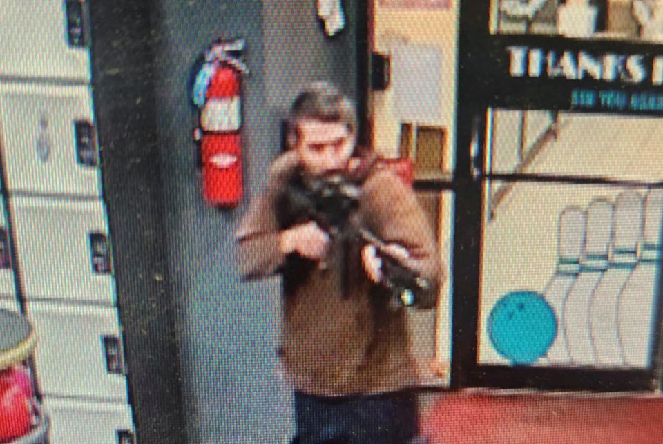 Law enforcement officials released a photo of a man with a semiautomatic rifle they were calling a suspect in a mass shooting in Lewiston, Maine, on Oct. 25, 2023. / Credit: Androscoggin County Sheriff's Office via REUTERS