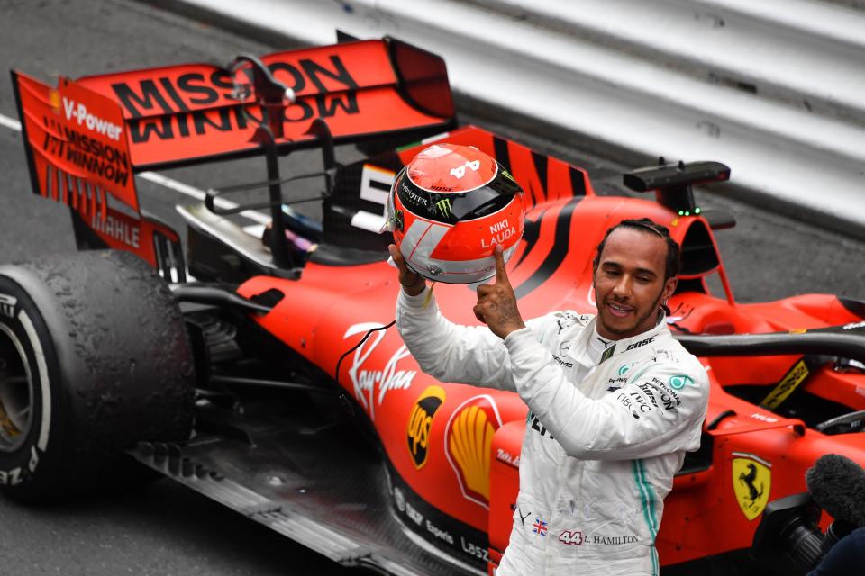 Lewis Hamilton points at the name of late F1 legend Niki Lauda after winning the Monaco GP  (Photo credit should read YANN COATSALIOU/AFP/Getty Images)