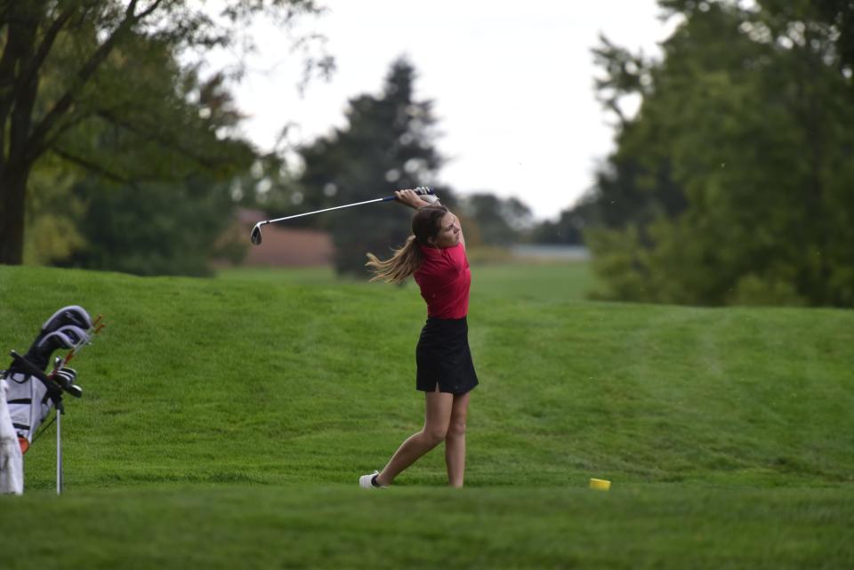 Almont's Tara Tencza hits a tee shot onto the green during a practice round at Heather Hills Golf Club in Romeo on Thursday.