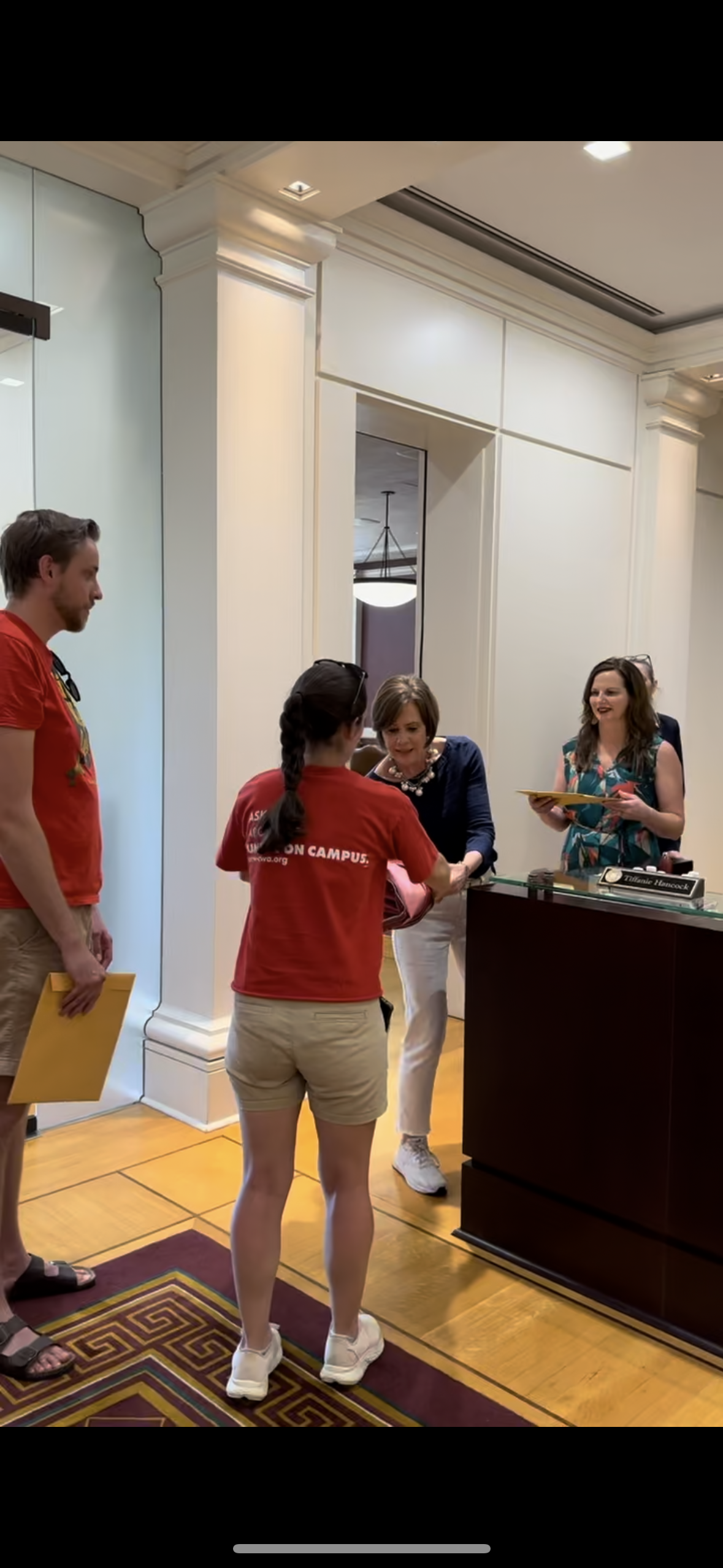 Zach Dykema and Patricia McCourt with the Mississippi State University chapter of the United Campus Workers of Mississippi present a petition to MSU President Mark Keenum's office asking for living wages and other benefits for university employees.