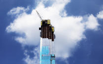 In this July 31, 2019 photo, the Central Park Tower is under construction in New York. (AP Photo/Mark Lennihan)