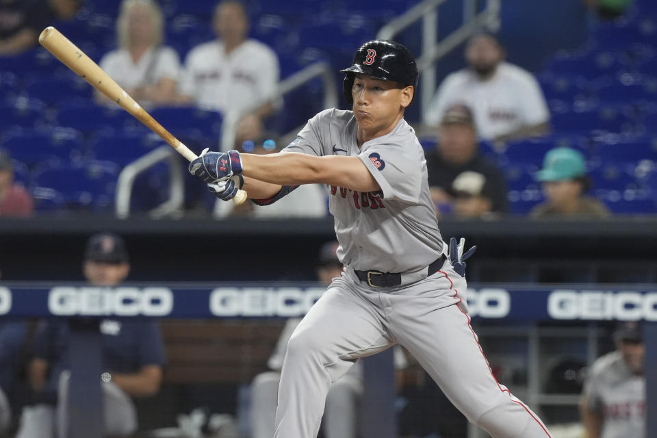 Boston Red Sox's Masataka Yoshida hits a single during the first inning of a baseball game against the Miami Marlins, Tuesday, July 2, 2024, in Miami. (AP Photo/Marta Lavandier)