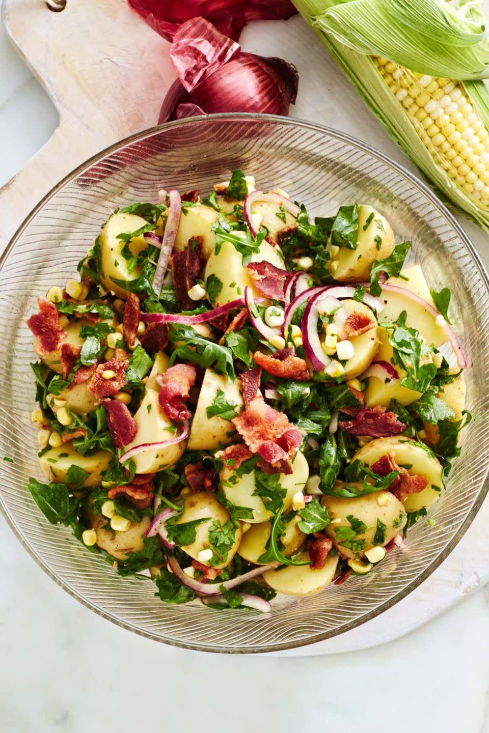 <p>This vibrant potato salad — which includes sweet corn, bacon, and red onions — will brighten up any family dinner. </p><p><strong><em><a href="https://www.womansday.com/food-recipes/food-drinks/recipes/a12896/potato-salad-sweet-corn-bacon-red-onion-recipe-wdy0614/" rel="nofollow noopener" target="_blank" data-ylk="slk:Get the Potato Salad with Sweet Corn, Bacon, and Red Onion recipe;elm:context_link;itc:0;sec:content-canvas" class="link ">Get the Potato Salad with Sweet Corn, Bacon, and Red Onion recipe</a>.</em></strong></p>