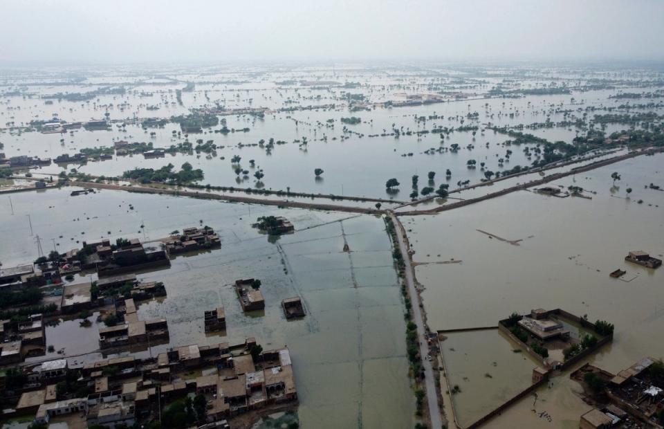 Homes are surrounded by floodwaters in Sohbat Pur City, a district of Pakistan's southwestern Baluchistan province (Zahid Hussain/AP)