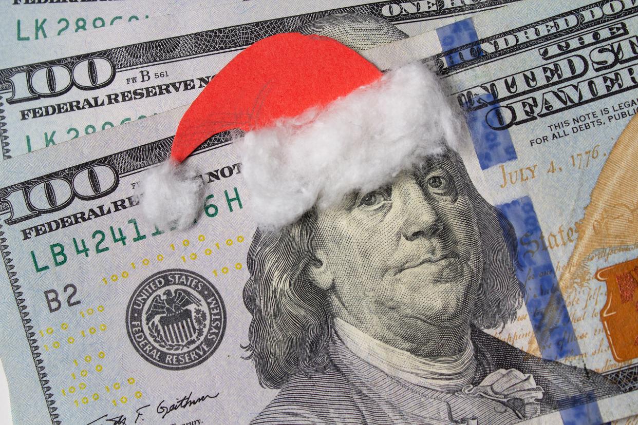 Benjamin Franklin in a Santa Claus hat on a bill