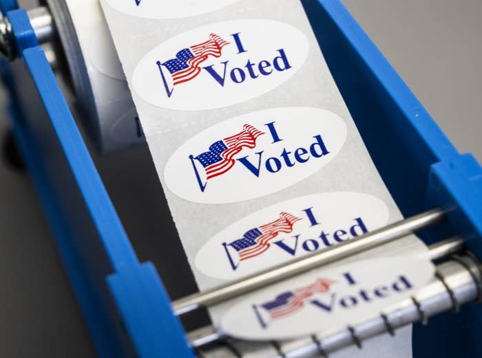 Voters pick up their “I Voted” sticker at Irvine Valley College in Irvine, California, on Nov. 8, 2022.