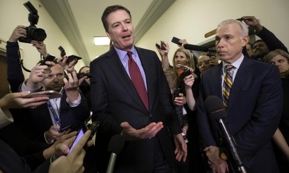 James Comey, with his attorney, David Kelley, right, speaks to reporters on Friday