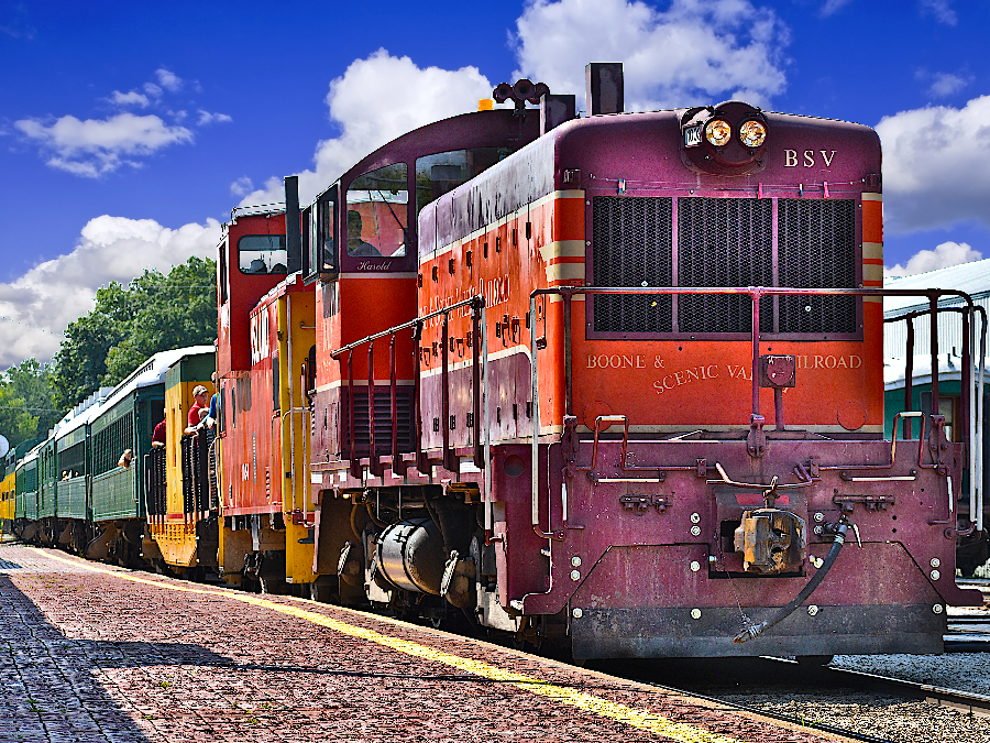Experience the beauty of Iowa's countryside from the luxurious comfort of the Boone & Scenic Valley Railroad.