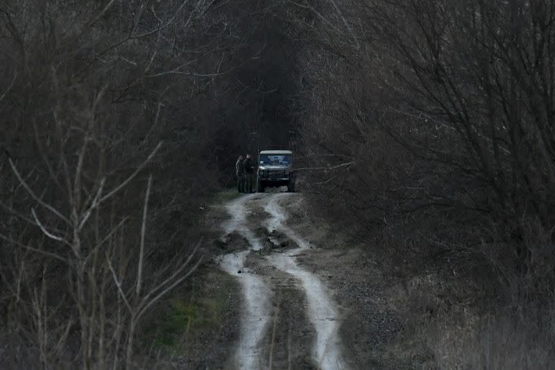 Greek soldiers patrol next to the Evros river, looking out for migrants and refugees crossing from Turkey into Greece, near the village of Marasia