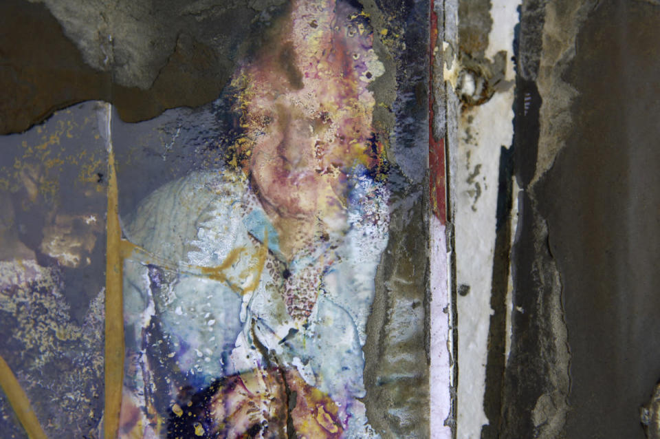 These damaged photos are physical reminders of Katrina