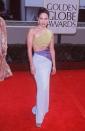 <p><strong>When: </strong>January 1998</p><p><strong>Where: </strong>The Golden Globes</p><p><strong>Wearing: </strong>An ab-baring colour-block gown</p>