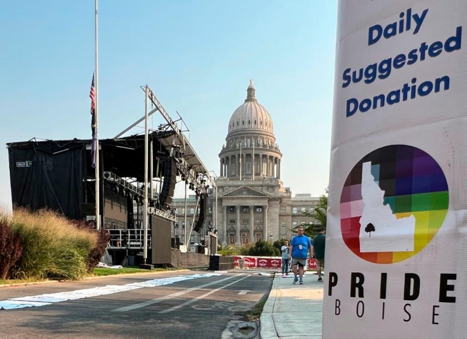 A Boise Pride Festival banner hangs on a lamp post in front of the Idaho Statehouse (Associated Press)