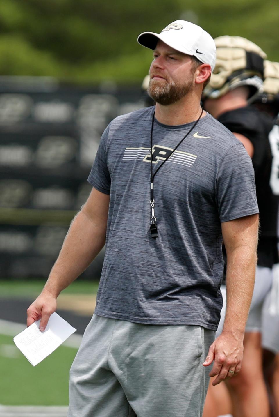 Purdue quarterback coach Brian Brohm watches a drill during a practice, Tuesday, Aug. 2, 2022, at Purdue University in West Lafayette, Ind. 