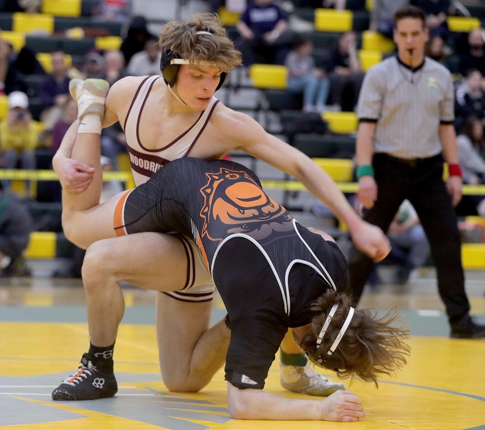 Woodridge 157 pounder Anthony Lahoski, left, battles Green's Matthew Galemmo during the title match at the Bill Dies Memorial Tournament earlier this season.