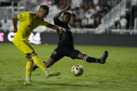 Nashville midfielder Hany Mukhtar shoots past Inter Miami defender Kelvin Leerdam, during the first half of an MLS soccer match, Wednesday, Sept. 22, 2021, in Fort Lauderdale, Fla. (AP Photo/Rebecca Blackwell)