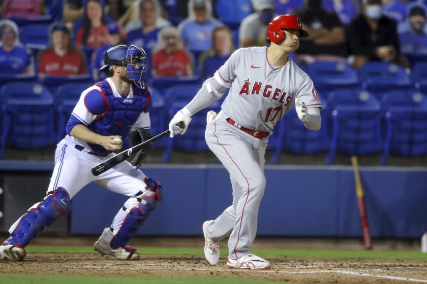 Los Angeles Angels' Shohei Ohtani strikes out in front of Toronto Blue Jays catcher Danny Jansen during the fifth inning of a baseball game Thursday, April 8, 2021, in Dunedin, Fla. The Angels won 7-5. (AP Photo/Mike Carlson)