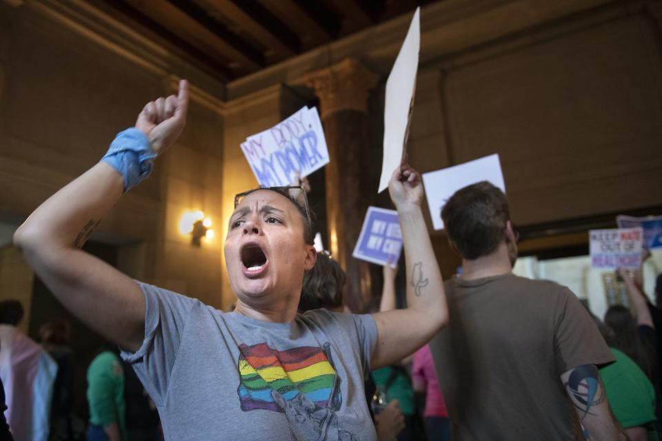 Brenna Thompson protests this month against an abortion ban and restrictions on gender-affirming care for children in Lincoln, Neb. Justin Wan/Lincoln Journal Star via AP/KOLN-TV OUT