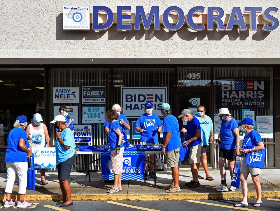 Bob McCaa, in center, coordinating volunteers at the Manatee County Democratic Party headquarters
on Wednesday afternoon, Oct. 28, 2020. Here volunteers prepare to head out into Bradenton area neighborhoods to drop off voting information about the candidates. It's a "no knock" no contact door-to-door canvassing effort to get the people out to vote.