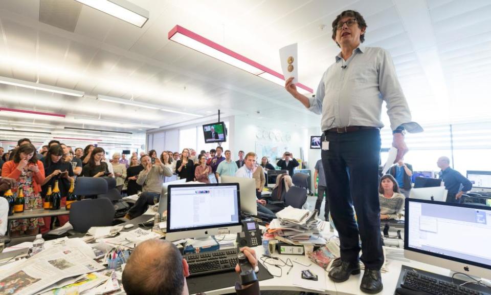 Alan Rusbridger standing on a desk