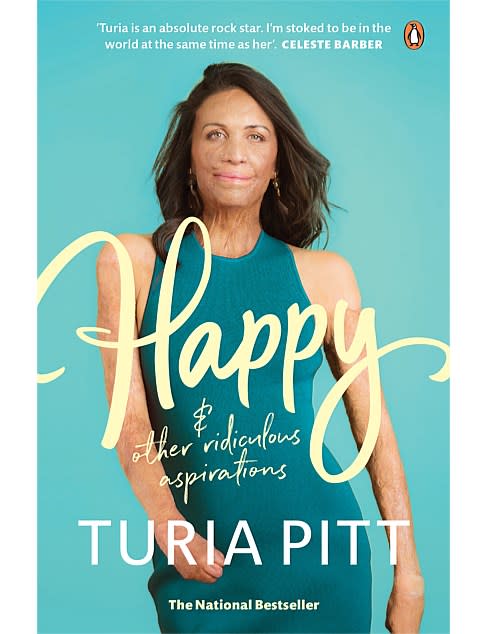 Cover of Happy (and other ridiculous aspirations) by Turia Pitt, $20.35 showing the writer in a green knit dress. Turia was burned in a bushfire but looks fabulous and stares candidly at the camera, despite her scars.