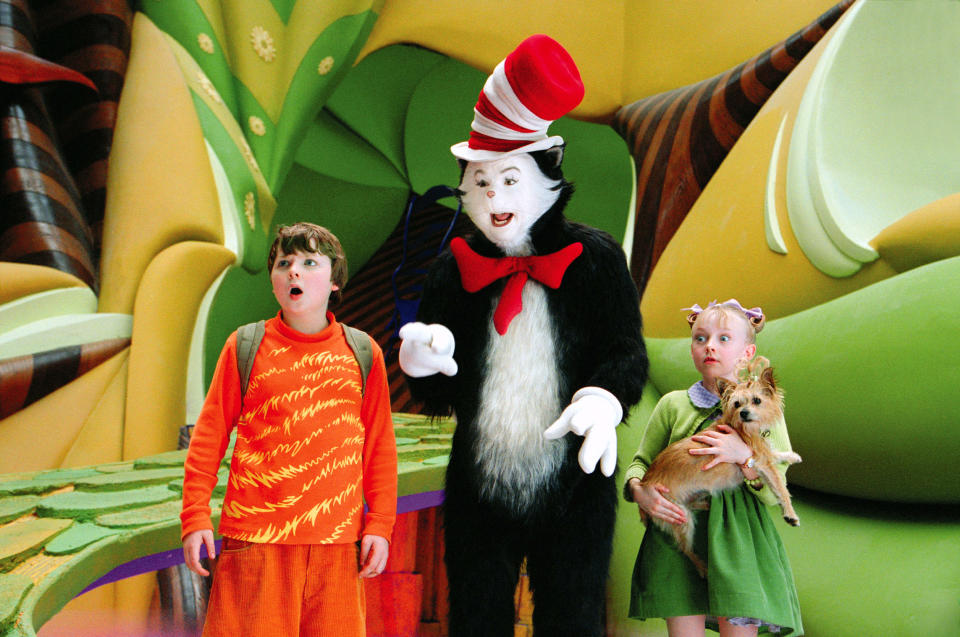 Spencer Breslin, Myers and Dakota Fanning in a scene from The Cat in the Hat. (Universal/Courtesy Everett Collection)