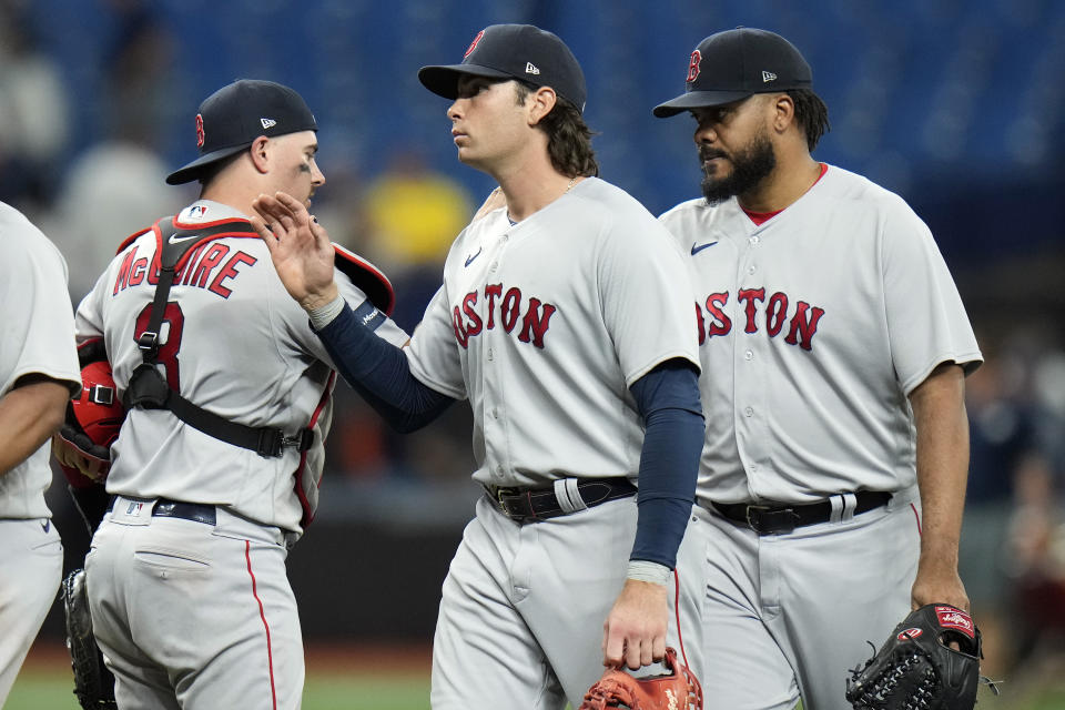 Boston Red Sox players, from left, catcher Reese McGuire, first baseman Triston Casas, and relief pitcher Kenley Jansen celebrate after the team defeated the Tampa Bay Rays during a baseball game Monday, Sept. 4, 2023, in St. Petersburg, Fla. (AP Photo/Chris O'Meara)