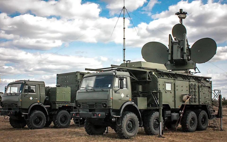 A picture showing a complete Krasukha-4 system, with the truck-mounted command post 'container' seen behind the vehicle carrying the EW component, in 2017 - Russian Ministry of Defence/Russian Ministry of Defence