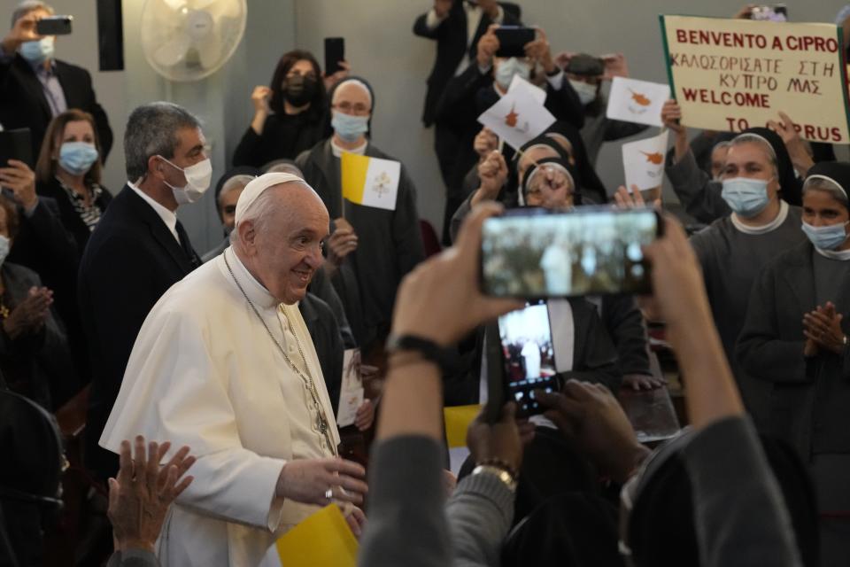 Pope Francis arrives to attend a ceremony at the Maronite Cathedral of Our Lady of Graces in Nicosia, Cyprus, Thursday, Dec. 2, 2021. Pope Francis' trip to Cyprus and Greece is drawing new attention to the plight of migrants on Europe's borders and the disconnect between Francis' Gospel-driven call for countries to welcome and integrate them and front-line governments that are increasingly unwilling or unable to let them in. (AP Photo/Alessandra Tarantino)