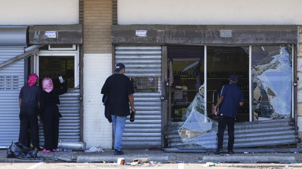 People view a ransacked liquor store in Philadelphia, Wednesday, Sept. 27, 2023. Police say groups of teenagers swarmed into stores across Philadelphia in an apparently coordinated effort, stuffed bags with merchandise and fled. (AP Photo/Matt Rourke)