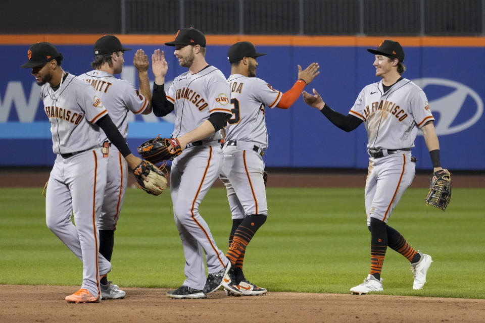 The San Francisco Giants celebrate after defeating the New York Mets in a baseball game Friday, June 30, 2023, in New York. (AP Photo/Mary Altaffer)