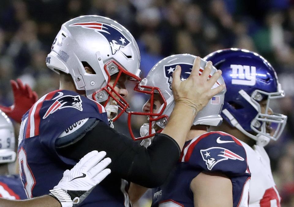 New England Patriots quarterback Tom Brady, left, celebrates his touchdown with Gunner Olszewski after scoring on a quarterback sneak in the second half of an NFL football game against the New York Giants, Thursday, Oct. 10, 2019, in Foxborough, Mass. (AP Photo/Elise Amendola)