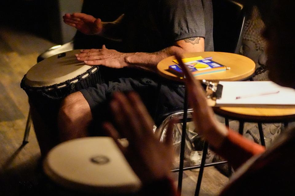 Djembe drums are used to help release negative energy during a weekly drum circle at Grounded32 in Phoenix on July 25, 2022.