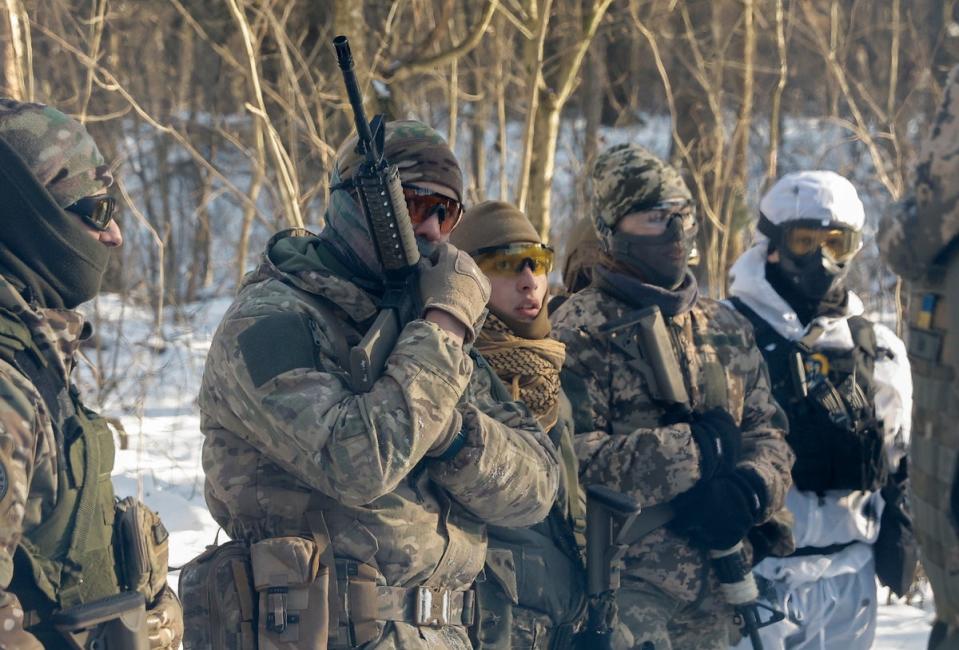 Ukrainian civilians attend their final military training after a five-day course near Kyiv, Ukraine, 12 January 2024 (EPA)