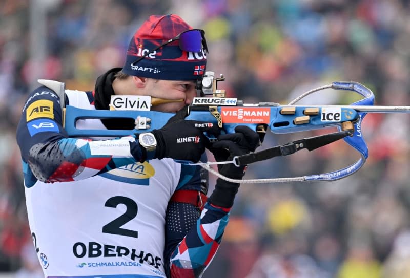 Norway's Sturla Holm Laegreid in action at the shooting range during the men's pursuit 12.5 km of the Biathlon World Cup in the Lotto Thüringen Arena at Rennsteig. Martin Schutt/dpa