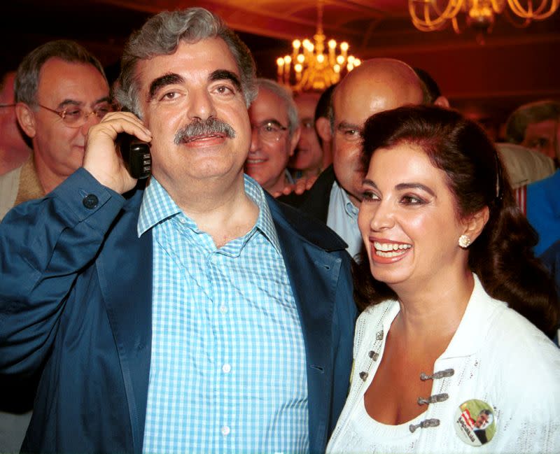 FILE PHOTO: Lebanon's former Prime Minister Rafik al-Hariri recieves cogratulations after a late-night broadcast of unofficial parliamentary results in Beirut