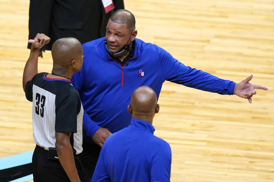 Philadelphia 76ers coach Doc Rivers, right, talks with official Sean Corbin (33) during the first half of the team's NBA basketball game against the Miami Heat, Thursday, May 13, 2021, in Miami. (AP Photo/Lynne Sladky)