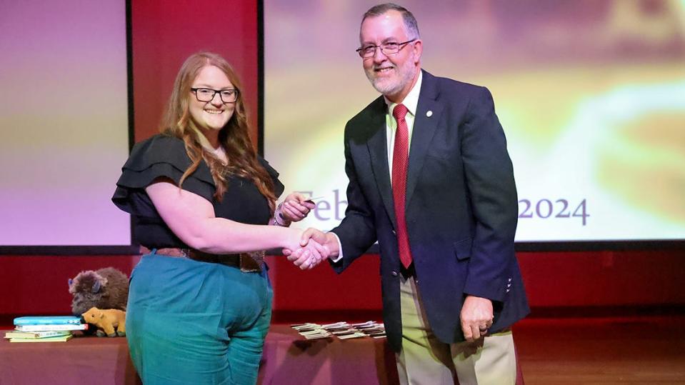 Dr. Gary Bigham, dean ofWest Texas A&M University's Terry B. Rogers College of Education and Social Sciences, congratulates Brylea Ervin, the first education student to be pinned in a new ceremony at WT on Tuesday, Feb. 6.