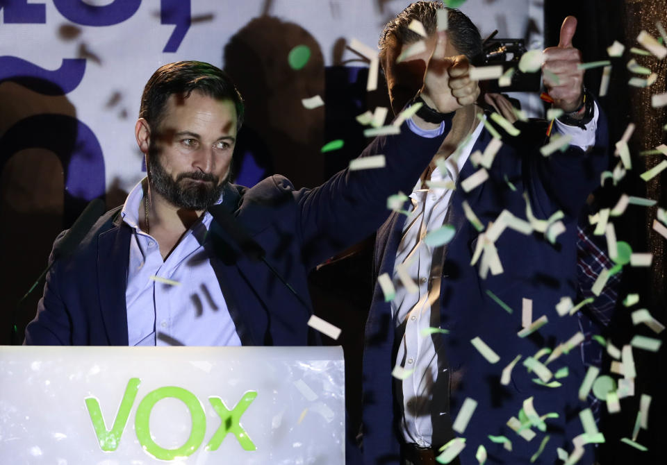 Santiago Abascal, leader of far right party Vox, gestures supporters gathered outside the party headquarters following the general election in Madrid, Sunday, April 28, 2019. A divided Spain voted Sunday in its third general election in four years, with all eyes on whether a far-right party will enter Parliament for the first time in decades and potentially help unseat the Socialist government. (AP Photo/Manu Fernandez)
