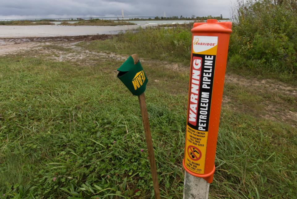 A marker on the north shore of Straits of Mackinac indicates where a pipeline enters the water Tuesday, September 27, 2016 in St. Ignace, Mich. Just west of the iconic bridge are two oil pipelines laid in 1953 that span the bottom of the Straits of Mackinac, the 5 mile-wide strip of water separating Lakes Michigan and Huron that is whipsawed by currents unlike anywhere else in the Great Lakes.