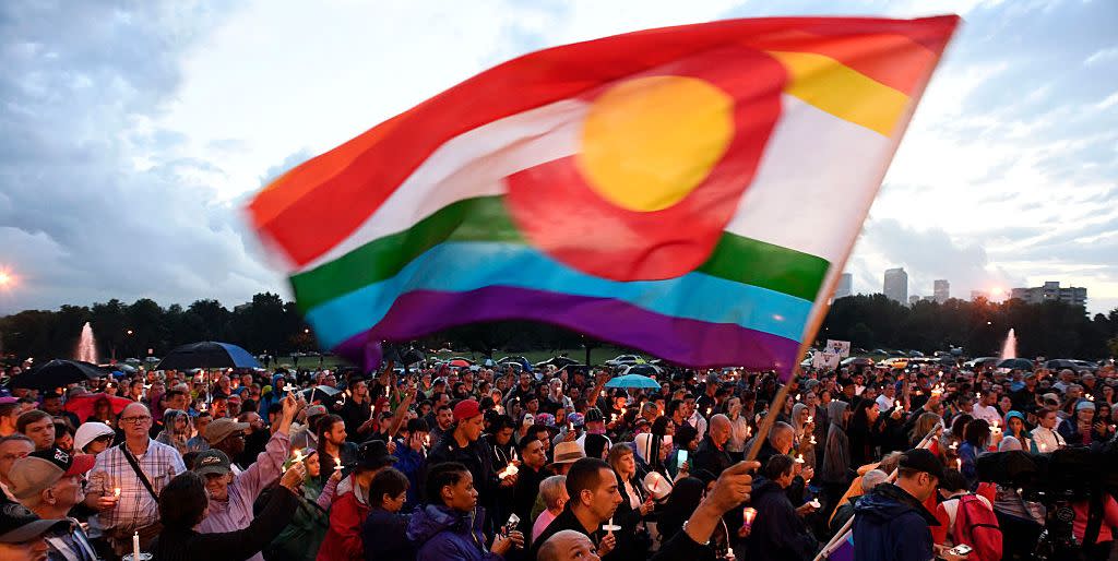 denver, co   june 13 mark wonder waves his rainbow color colorado flag as he and about 2,000 supporters attended the pflag denver chapter candle vigil june 13, 2016 at cheeseman park a silent candle vigil was held in support of the tragic event at pulse night club in orlando, florida  photo by john leybathe denver post via getty images