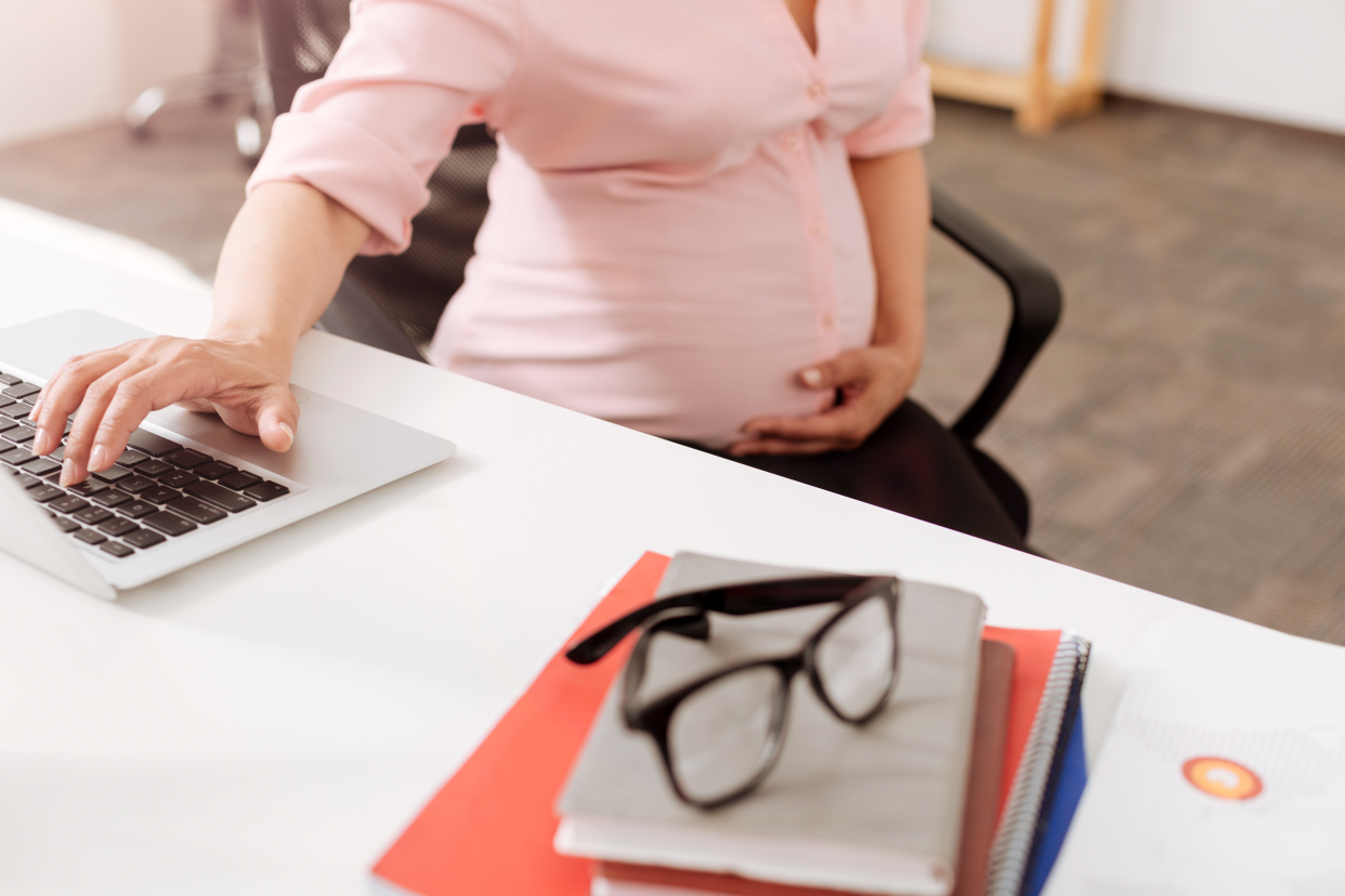 Pregnant woman at the office