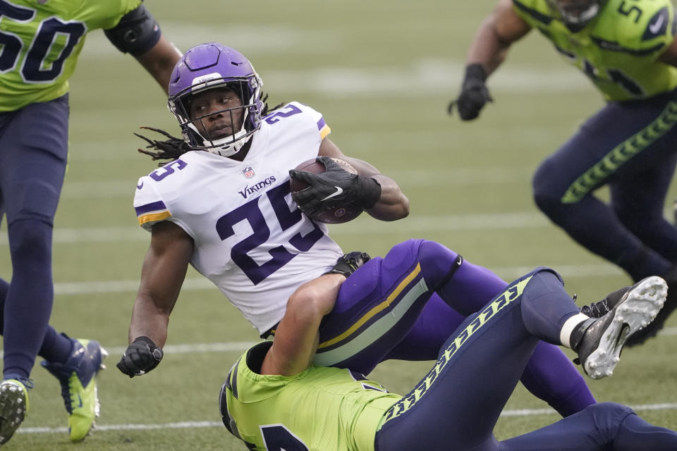 Minnesota Vikings running back Alexander Mattison is brought down by the Seattle Seahawks during the first half of an NFL football game, Sunday, Oct. 11, 2020, in Seattle. (AP Photo/Ted S. Warren)