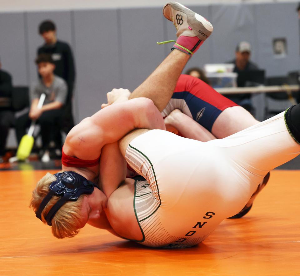 From left, Bridgewater-Raynham's Luke Driscoll, won the 175 pound finals wrestling match versus Duxbury's Matt Walsh during Division 2 South Sectionals on Saturday, Feb. 10, 2024.