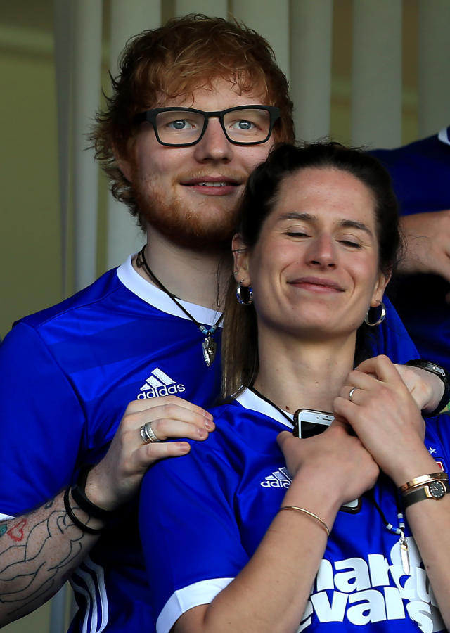 Musician Ed Sheeran and fiance Cherry Seaborn look on during the Sky Bet Championship match between Ipswich Town and Aston Villa at Portman Road on April 21, 2018 in Ipswich, England. (Photo by Stephen Pond/Getty Images)