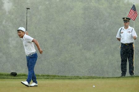 Jul 2, 2017; Potomac, MD, USA; Sung Kang reacts to missing a putt on the 16th hole during the final round of the Quicken Loans National golf tournament at TPC Potomac at Avenel Farm. Mandatory Credit: Geoff Burke-USA TODAY Sports