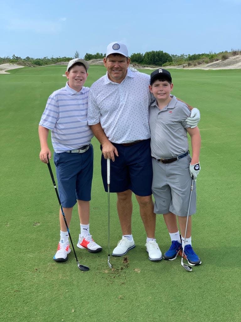 Bret Baier with his sons, Paul, far left, and Daniel, on the golf course.