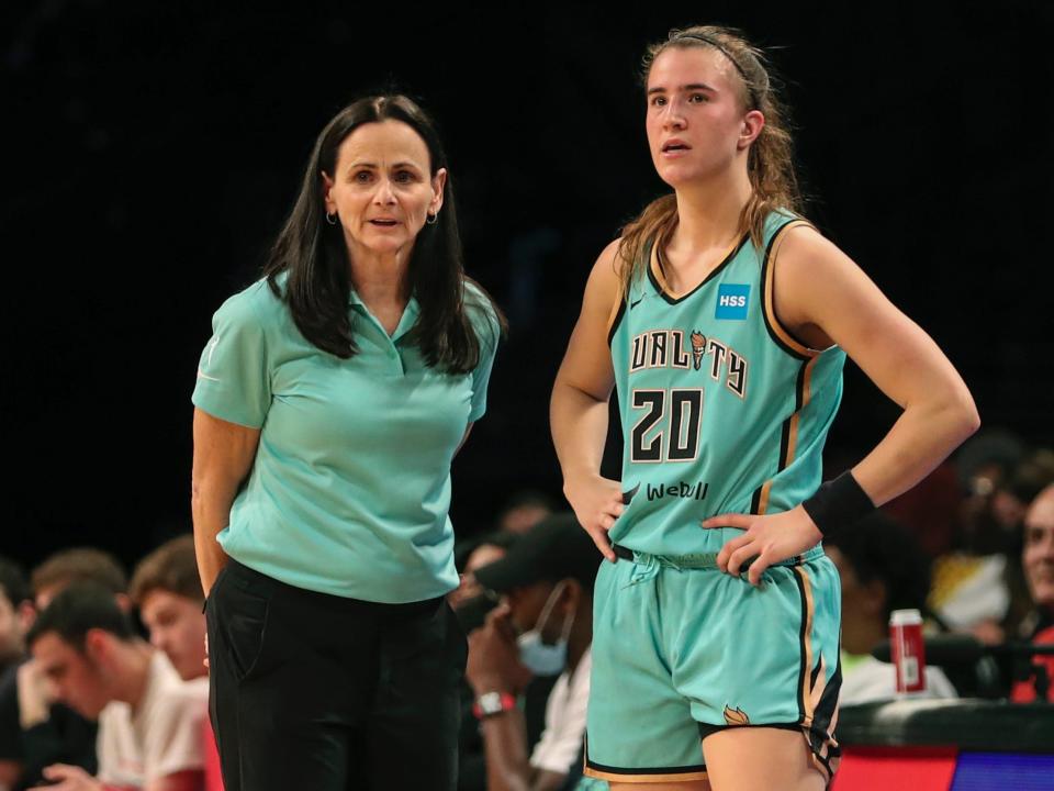 New York Liberty head coach Sandy Brondello (left) and star Sabrina Ionescu talk on the sideline.